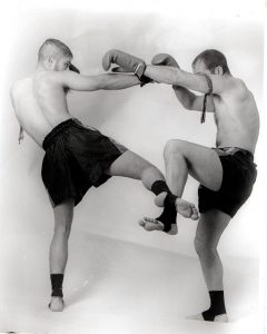 Two Muay Thai opponents display strength and balance